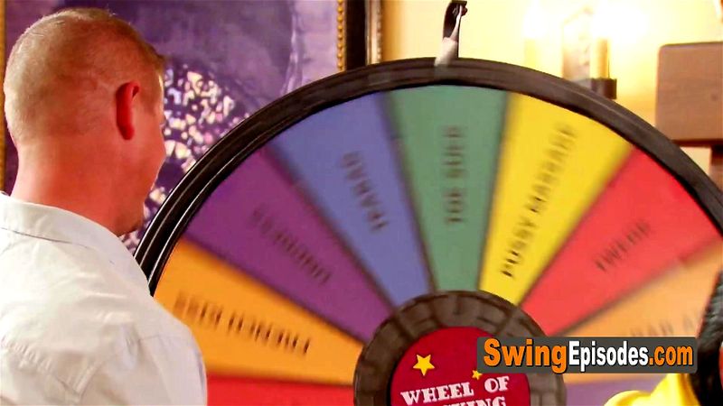 Group of horny swingers playing wheel of fucking