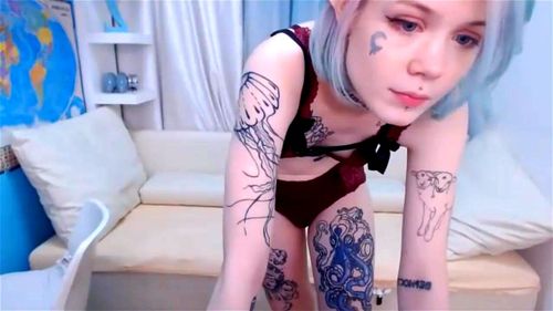 Blonde teen Loli Cutie flashes her skinny tattooed body