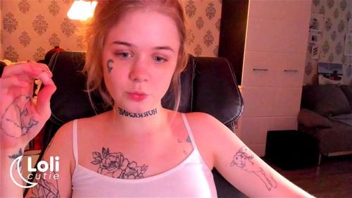 Tattooed blonde teen Loli Cutie teases at home