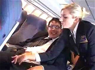 American air hostess strokes a Japanese customer's cock